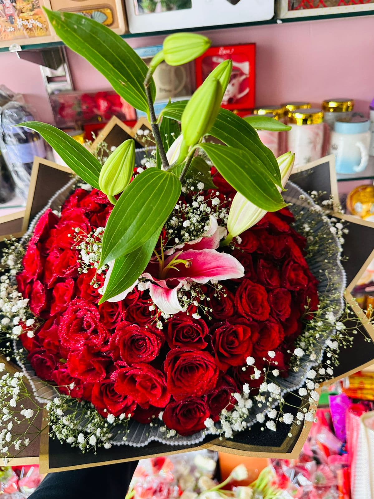 Grand red rose bouquet with pink lilies and baby's breath